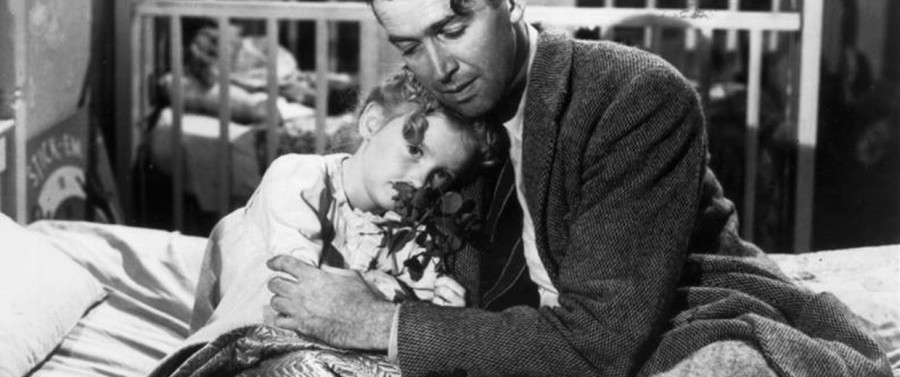 George Bailey from "It's a Wonderful Life" hugs his daughter Susan. 