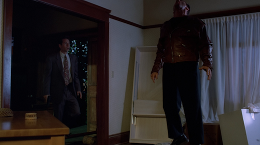 Mulder walks in and sees one of Lauren's assailants hanging in mid-air.