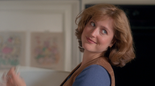 Scully turns to smirk over her shoulder at her friend.
