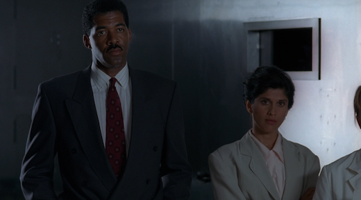 The two other agents of the episode stand side by side.