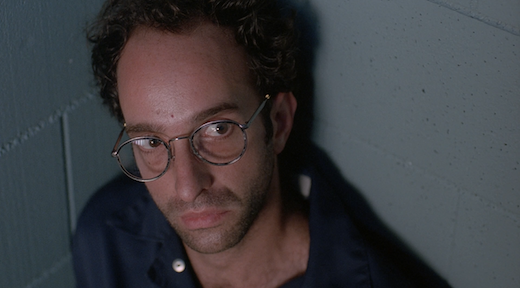 Wilczek looks up at Mulder.