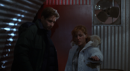 Mulder and Scully argue about how best to keep others safe from the parasite.