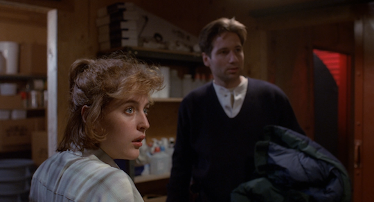 Scully looks at Hodge in outrage when he accuses her of being infected.