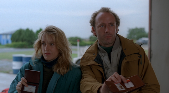Hodge and de Silva brandish their ID.